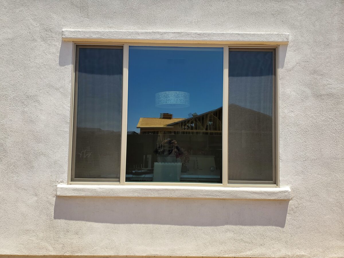 Almond vinyl window installed in a Phoenix home